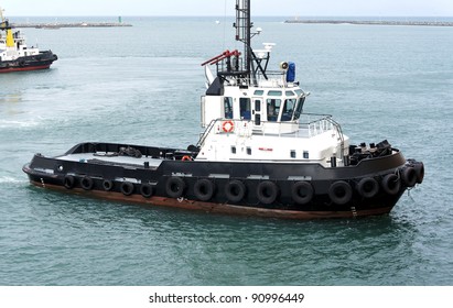 Isolated Tug Boat In Lome' Port