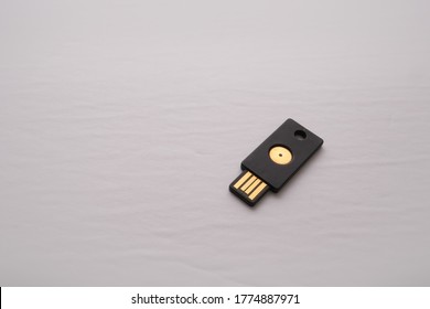 An isolated USB device containing a security key is used for two-factor authentication adding a layer of security to logins and authorization online.