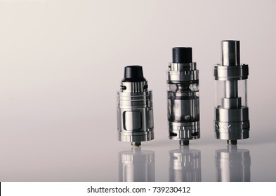 isolated vape tanks for electronic cigarette or e cig over a white background. vaping heads. 