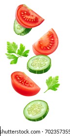 Isolated Vegetables. Mixed Slices Of Cucumber And Tomato In The Air Isolated On White With Clipping Path