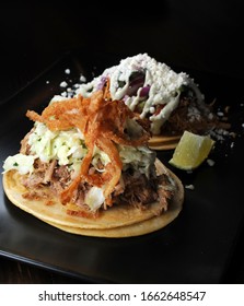 Isolated Vertical Image Of Carnitas And Pulled Chicken Taco’s