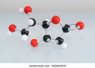 Isolated vitamin C made by molecular model with reflection on white background. Ascorbic acid chemical formula with colored atoms and bonds. - Powered by Shutterstock