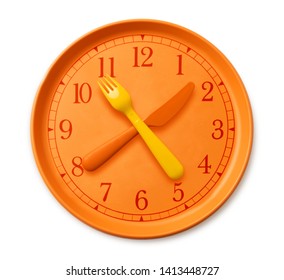 isolated watch on the orange plate, where instead of arrows yellow orange fork and knife. plastic utensils and clock on the table. concept of diet and health