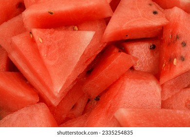Isolated watermelon cut into triangular pieces