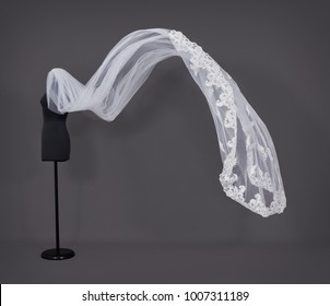 Isolated Wedding Veil On A Grey Background.