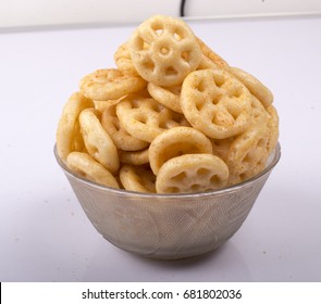 isolated wheeler fryums corn rings or snacks in bowl
