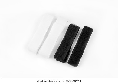 isolated white and black hook-and-loop fastener on white background