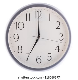 isolated white clock at seven