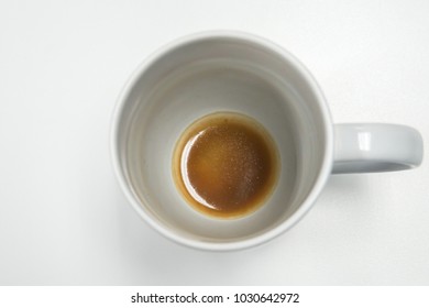 Isolated White Mug With Coffee Stain And Residue At Bottom On Office Desk