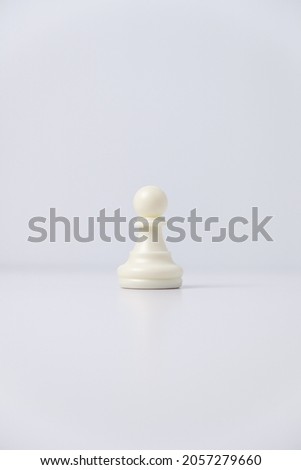isolated white pawn chess piece on white background