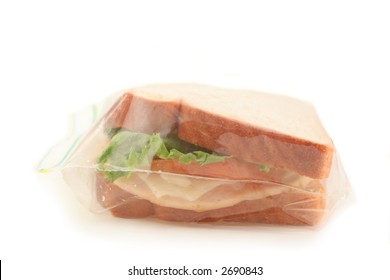 Isolated Whole Wheat Sandwich In Clear Plastic Bag