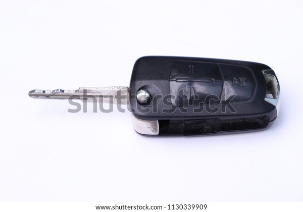 Isolated wireless remote control key for the\
car on a white\
background.