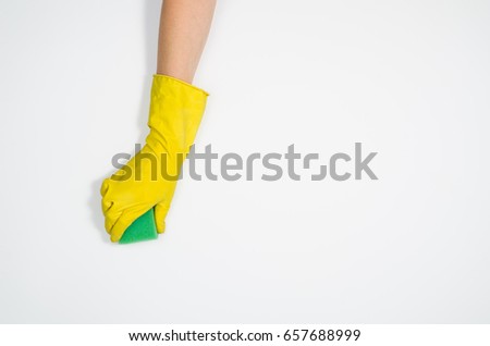 Isolated woman's hand cleaning on a white background. Cleaning or housekeeping concept background. Frame for text or advertising