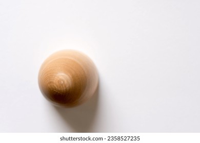 isolated wooden crafting ovoid object on paper