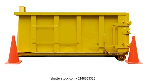 Isolated yellow construction dumpster with orange safety cones.