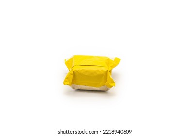 Isolated Yellow Postal Package from shopping online, is delivered to the buyer. It's shot in the studio light in front of white background