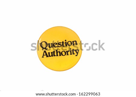 Isolation against white of QUESTION AUTHORITY button, lettering in black & background in yellow