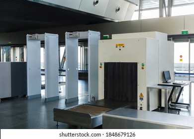 Isolation Mode In Moscow, Covid Pandemic And Night View Of The Empty Terminal Of The International Airport. Airport Security Check Point With Metal Detector And X Ray Scaner.