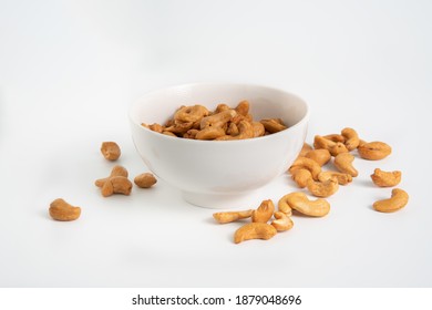 Isoloated Roasted Cashew Nuts In White Crockery