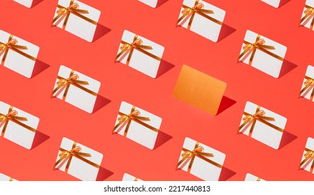 Isometric pattern of credit cards, gift cards, bonus cards. consumer concept, on a red background. Gifts for Christmas, Valentine's Day and birthday