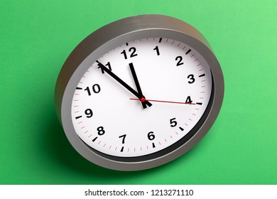 Isometric Wall Clock On A Green Background