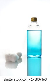 Isopropyl Alcohol Bottle And Cotton Wool On Isolated Background