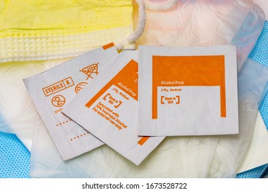 Isopropyl Alcohol Wipes On Top Of Dressing Gauze With Part Of Face Mask Showing