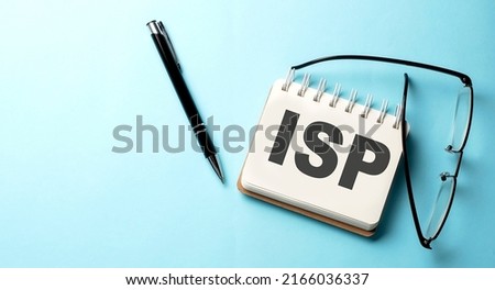 ISP text written on notepad on the blue background