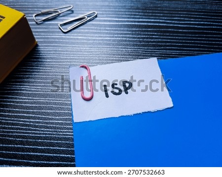 ISP writting on table background. 