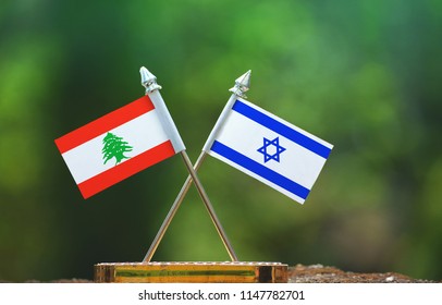 Israel And Lebanon Small Flag With Blur Green Background