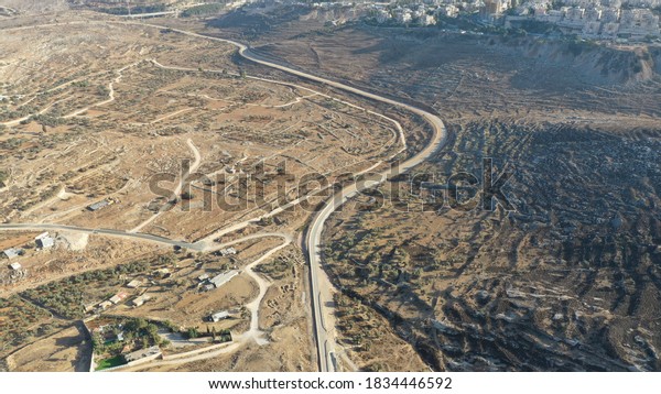 Israel Palestine border in Jerusalem\
Mountains- aerial view\
drone image divide Ramot and Beit hanina\
(Abu Dahuk) neighborhoods northwest East Jerusalem\
\
