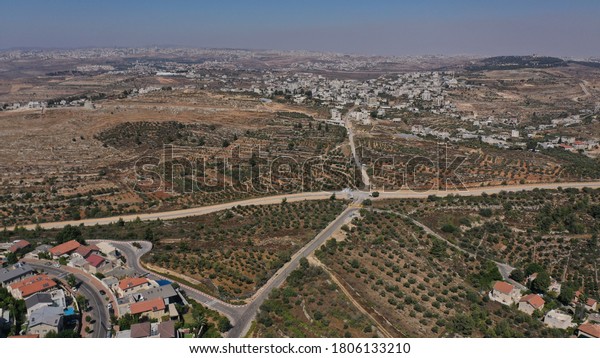 Israel and palestine divided by hill and security\
fence, aerial viwe