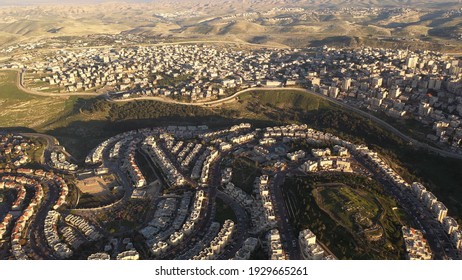 Israel and Palestine divided by security wall, aerial view
drone view with anata refugees camp and pisgat zeev neighborhood
