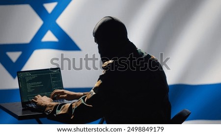 Israel secret police agent uses mass propaganda tools on laptop to influence population minds, engaging in psychological operations. Mossad Israeli spy commits PsyOp sabotage using device, camera A