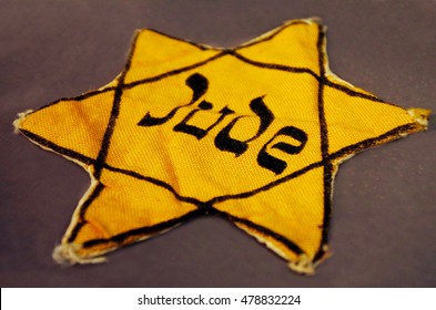 ISRAEL- SEP 04 2016:Yellow Jewish badge. It is a cloth patch that Jewish people were ordered to sew on their outer garments to mark themselves in public in certain times during their history.