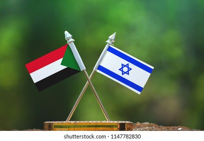 Israel And Sudan Small Flag With Blur Green Background