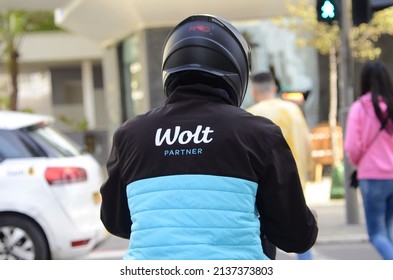 Israel. Tel Aviv 16 March 2022: Wolt Delivery Man Driving In Street. Wolt Is A Finnish Online Food Delivery Application Recently Bought By Door Dash