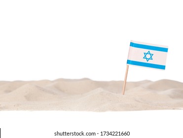 Israel Toothpick Paper Flag On White Beach Sand. Isolated On A White Background