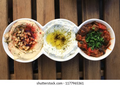 Israeli Appetizer Set - Matbucha With Eggplant, Labneh With Zaatar And Hummus