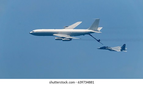 Israeli Fighter Jet And Tanker In Air Refueling. The Jets Flight From Right To Left In Formation.