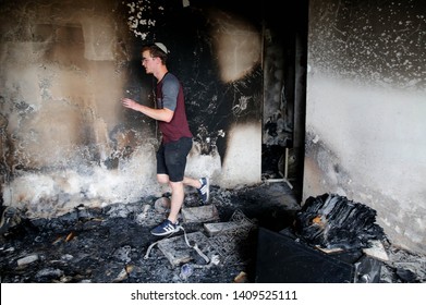 An Israeli Man Checks His Burnt-down House Following A Fire Amidst Extreme Heat Wave In The Village Of Mevo Modi'im, Israel, On May 26, 2019. Gil Cohen Magen