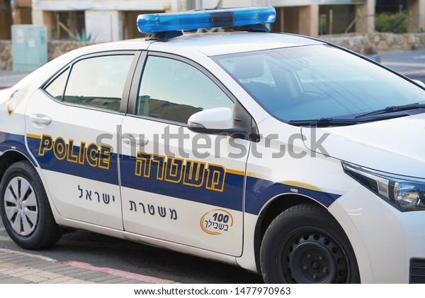 Israeli police car with text and\
logo close-up. Nobody in the vehicle. 13 August 2019. Tel Aviv.\
Israel                                                             \
