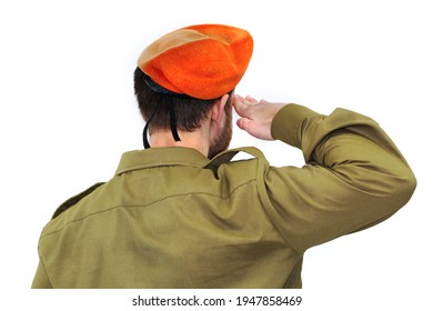 Israeli Soldier With Israel Flag Salutes In An Orange Beret. White Isolated Background