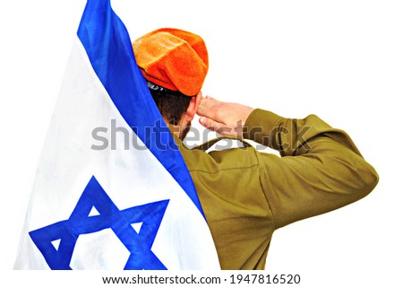 Israeli soldier with Israel flag salutes in an orange beret. White isolated background