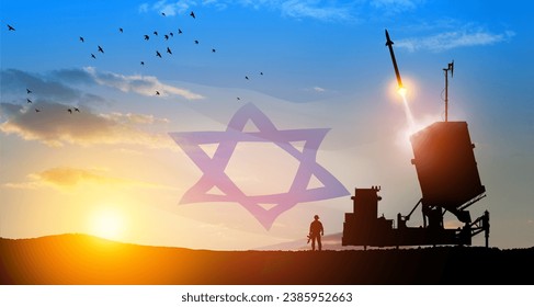 Israel's Iron Dome air defense missile launches. Silhouettes of soldier and Israel's Iron Dome air defense. The missiles are aimed at the sky at sunset with Israel flag. Missile defense.