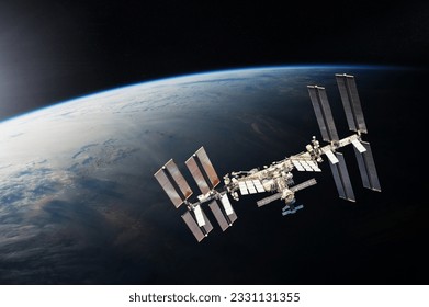 ISS over the planet Earth. Elements of this image furnished by NASA.