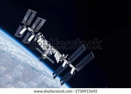 Iss over the planet Earth. Elements of this image furnished by NASA 