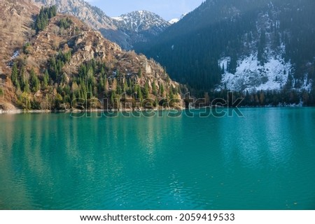 Issyk Lake, Ile-Alatau National Park. Almaty region, Kazakhstan. A lake formed behind the dam, about 1,750 meters by 1,500 meters and a depth of 50 to 90 meters, at an altitude of 1,756 meters.