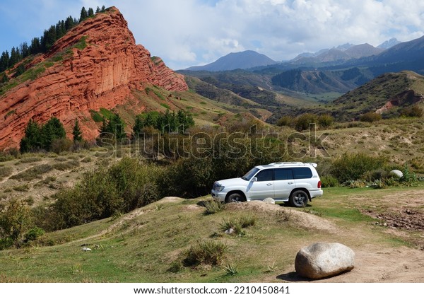 Issyk-Kul,
Kyrgyzstan - Sept 19, 2022: Off-road car shown in canyon Seven
bulls, Jeti-Oguz, Kyrgyzstan. Extreme mountain safari is one of the
main local tourist attractions in
Kyrgyzstan
