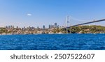 Istanbul Bosphorus Bridge or 15th July Martyrs Bridge with Istanbul panorama cityscape during summer sunny day. Istanbul, Turkiye